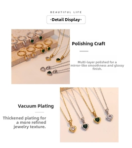 Detailed view of heart-shaped emerald necklaces and hoop earrings in gold and silver