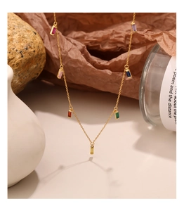 Detail of 925 sterling silver gold necklace featuring colorful rectangular zircon stones