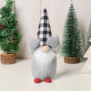 Christmas gnome plush toy with plaid hat and red feet in cozy holiday window display