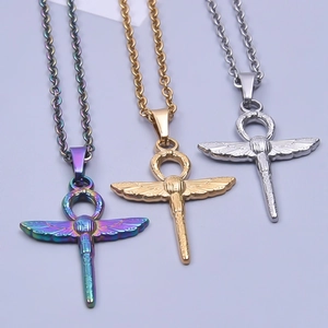 Detailed macro view of Egyptian Ankh and Scarab pendants in gold, silver, and rainbow finishes