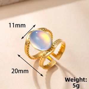 Macro shot showing dimensions of a vintage gold ring with iridescent oval gemstone