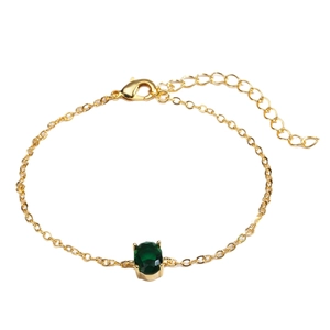 Elegant gold-plated bracelet featuring a dark green oval zircon with lobster clasp
