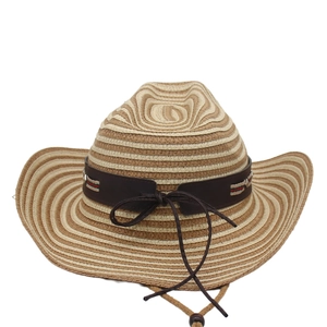 Detailed texture of straw cowboy hat with brown leather band and adjustable chin strap