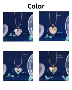 Detail of heart shield pendants in gold and silver with zircons and snake chains