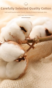 Macro view of natural soft raw cotton flowers on fabric used for pure cotton pads