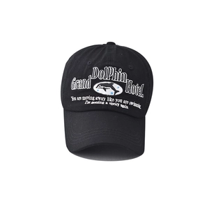 Vintage cotton baseball cap with dolphin hotel embroidery on washed black fabric