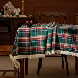 Classic red and green plaid tablecloth with white tassels for Christmas dining decor