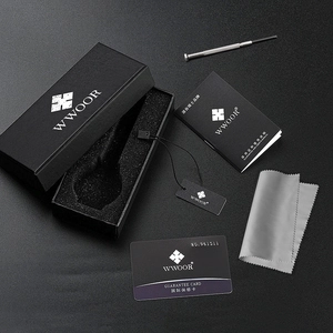 Detailed view of the luxury watch gift set including box, manual, tools and warranty card