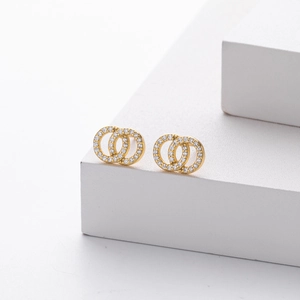 Elegant gold double interlocking hoop earrings with micro-pave white crystals