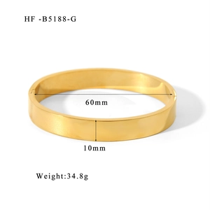 Detailed view of a 10mm wide gold plated stainless steel bangle showing size and weight