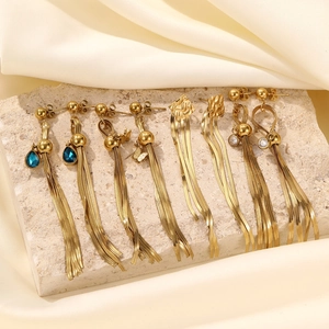 Luxurious gold tassel drop earrings set featuring butterfly and blue gemstone accents