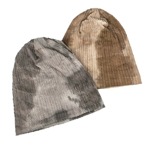 Detailed knit texture of tie-dye slouchy beanies in grey and khaki color variants