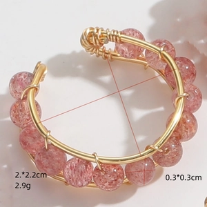 Handmade 14K gold plated wire wrapped ring featuring natural strawberry quartz beads