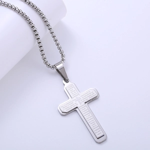 Double layered silver titanium steel necklace featuring a cross pendant with Spanish scripture