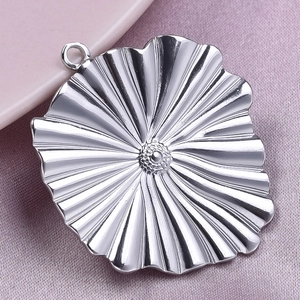 Detailed view of silver 304 stainless steel lotus leaf pendant with textured ripple finish