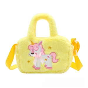 Detail of yellow plush unicorn bag with pink bow embroidery and adjustable strap