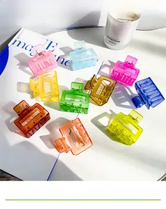 Detailed set of 10 colorful candy-toned square hair claws in a lifestyle setting