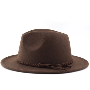 Close-up of dark brown suede fedora featuring a woven band with decorative tassel