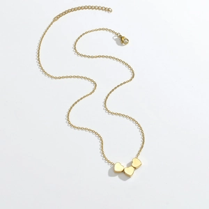 Elegant 18K gold-plated stainless steel necklace featuring three polished heart pendants