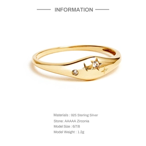 Macro detail of gold S925 sterling silver star ring with inlaid AAAAA zirconia stones