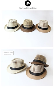 Detailed view of the woven paper straw texture on a striped multi-color fedora sun hat