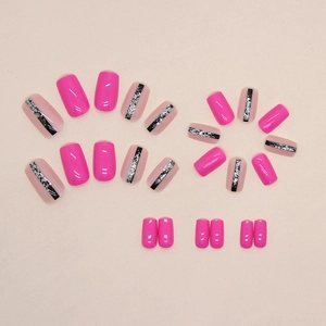 Magenta square press-on nails with black stripes and silver glitter accents