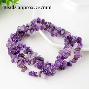Natural purple amethyst irregular bead bracelet with 5-7mm raw crystal stones on a ceramic plate
