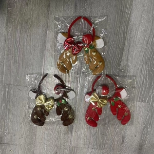 Three-piece Christmas reindeer antler headbands set in brown and red plush styles