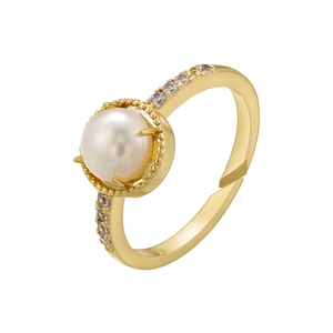Detail of gold-plated open ring featuring a large center pearl and cubic zirconia accents