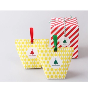 Christmas gift bags and boxes set with Merry Christmas tree stickers and festive ribbons