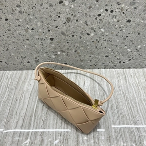 Top view of woven leather bag showing golden zipper detail and narrow shoulder strap