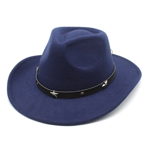 Detail of dark blue cowboy hat featuring a black leather band with silver star studs