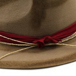 Close-up of wool jazz hat featuring vintage distressed brim and decorative silk ribbon