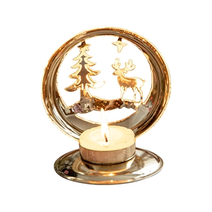Golden Christmas tea light holder with reindeer and tree cutouts on white background