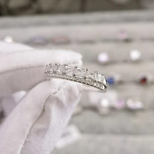 Macro detail of 925 silver ring featuring double-row square zircon and fine micro-pave