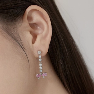 Close-up of S925 sterling silver bow earrings with pink bow and water drop pendant