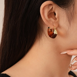 Brown tortoiseshell resin C-shaped hoop earrings with gold-plated metal trim for women