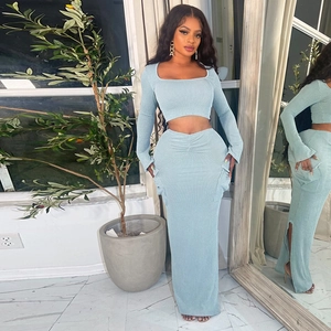 Detail of mint blue ribbed knit two-piece set featuring long sleeve square neck crop top
