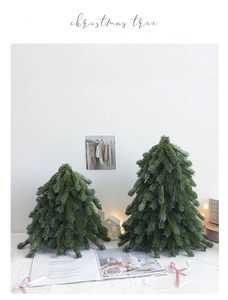 Set of two realistic PE mini Christmas trees on a white tabletop with lace and ribbon