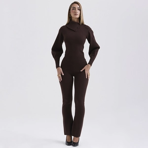 Detail of dark brown knit two-piece set featuring lantern sleeves and button-down collar