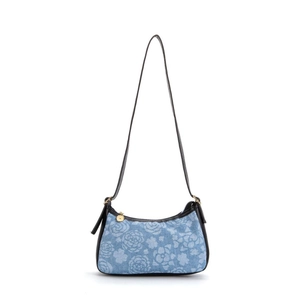 Blue denim underarm bag with white floral print and black shoulder strap and gold zipper