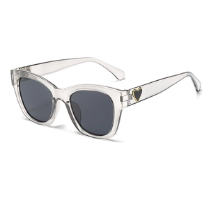 Stylish women's square sunglasses with transparent frames and black heart temple details.