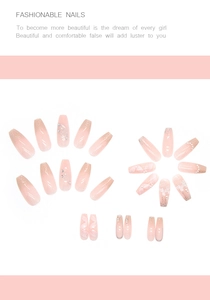 Detailed flat lay of pink gradient press-on nails with crystal butterflies and pearls