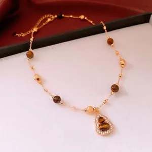 Gold plated tiger eye beaded necklace with a sparkling gourd pendant for women