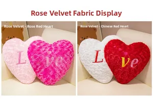 Detail of rose velvet heart pillows with Love embroidery and floral texture