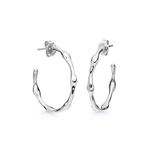French irregular silver lava C-shape earrings with modern organic wave design