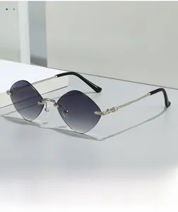 Detail of silver metal temples with cross patterns on rimless diamond gradient sunglasses