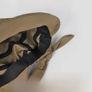 Detail of adjustable elastic band and bow decoration inside the khaki sun hat