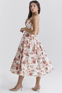Detail shot showing the floral print texture and drape of the French style sundress