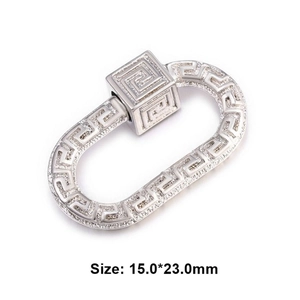 Macro shot of silver oval decorative buckle with Greek Meander pattern 15x23mm